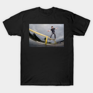 Skateboarder doing a board slide T-Shirt